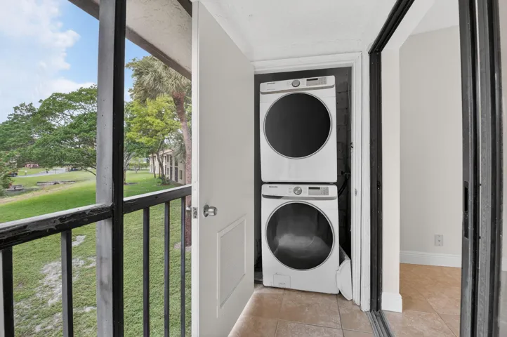 Screened balcony with black metal railing