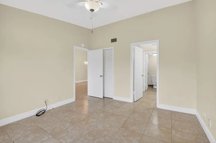 Neutral-toned walls complement the tile flooring