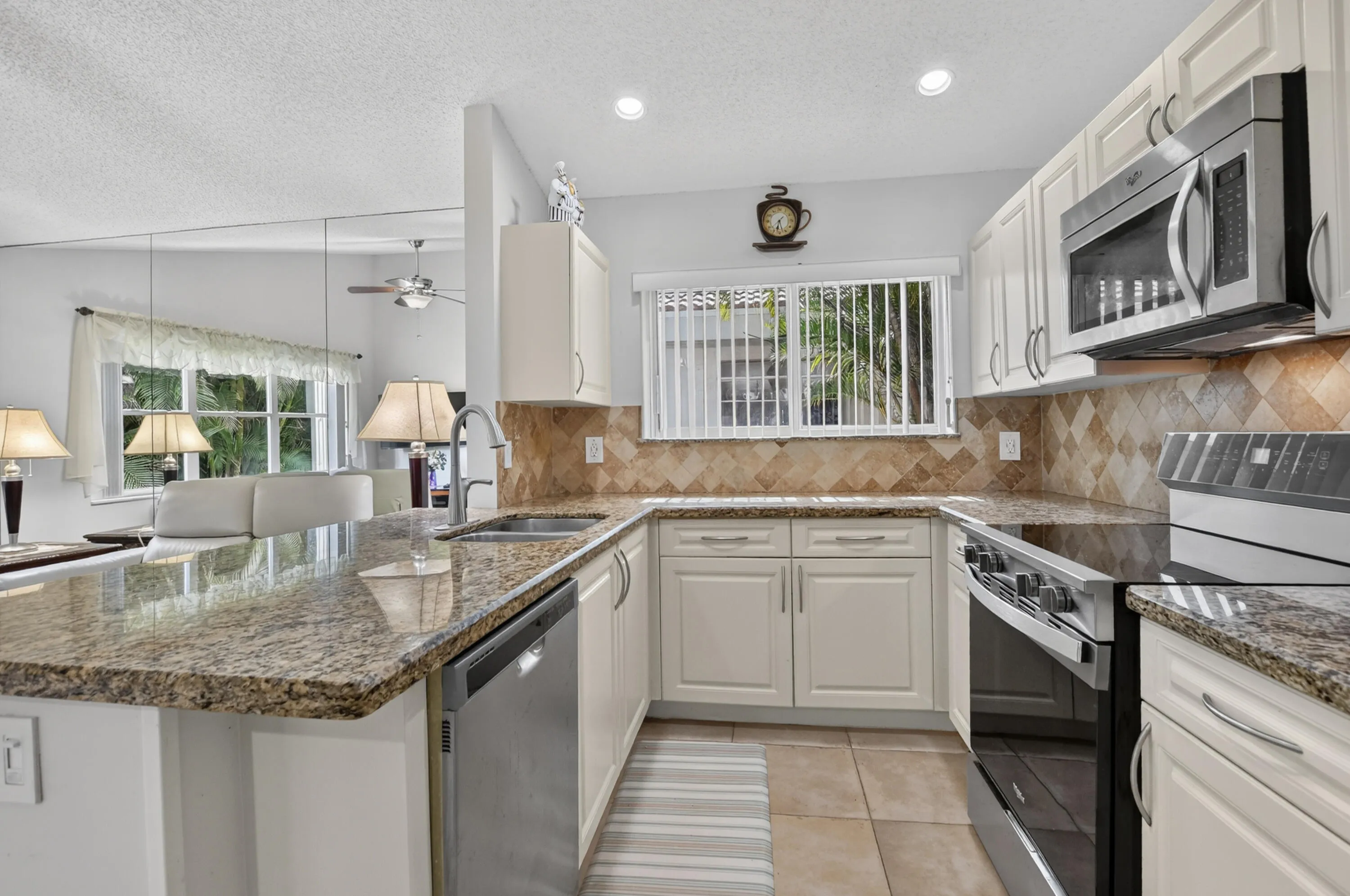 Updated kitchen with granite counter and SS appliances.