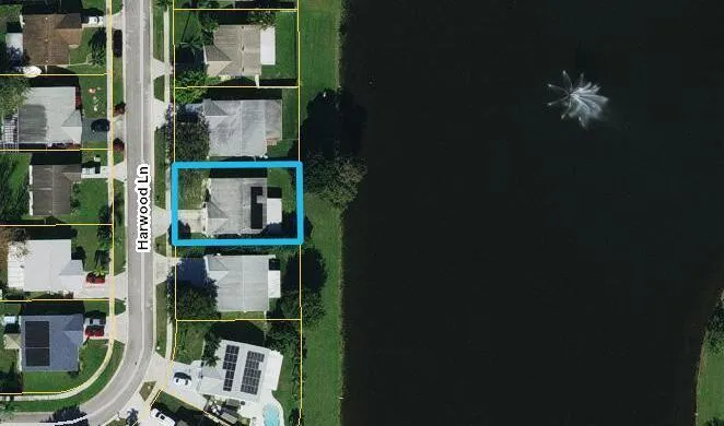 Aerial Map. Displaying the property's location on Harwood Ln relative to the waterway