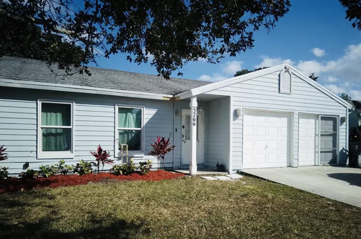 Light blue siding exterior with white trim