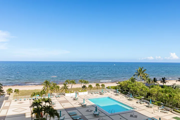 EXPANSIVE POOL DECK WITH LOUNGES, BBQ, AND HEATED POOL.