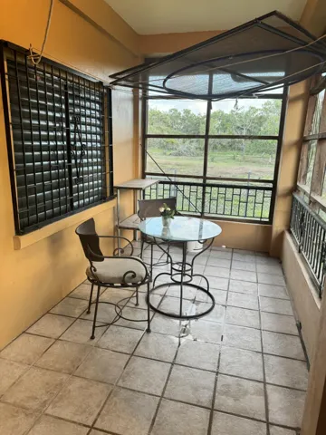 ENCLOSED FRONT PORCH