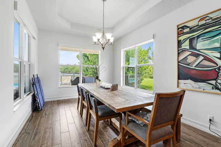 spacious dining room features windows on 3 sides