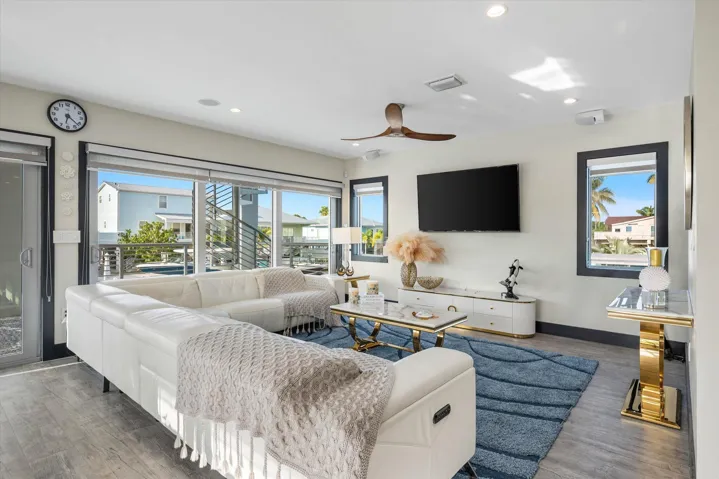 Large living area sold furnished including all TV, decorations and paintings.