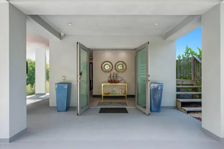 Double Impact Glass Doors leading to foyer