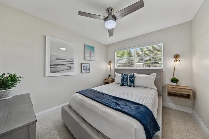 Recessed lighting, ceiling fan with integrated light, window with blinds, wall-mounted sconces, and floating wood-finish nightstands