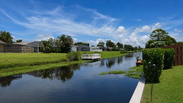 Enjoy long, peaceful canal views directly from the property's seawall, creating a serene waterfront backdrop. This navigable freshwater canal is ideal for Kayaking, fishing, and embracing the relaxed yet fun waterfront lifestyle.