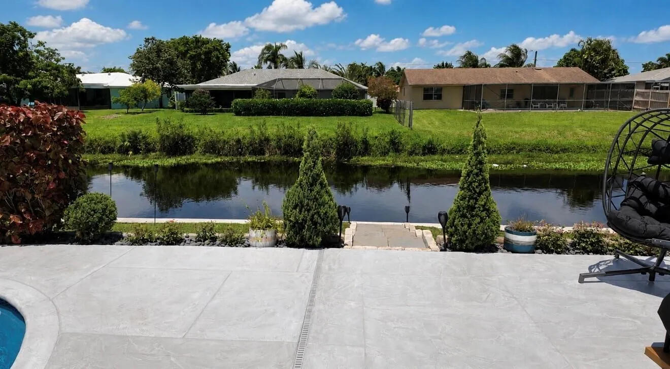 Thoughtful landscaping adds charm and character, enhancing this inviting waterfront retreat.