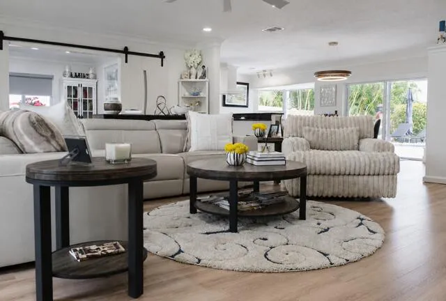 Coastal charm meets modern comfort in this bright, airy living room filled with natural light.