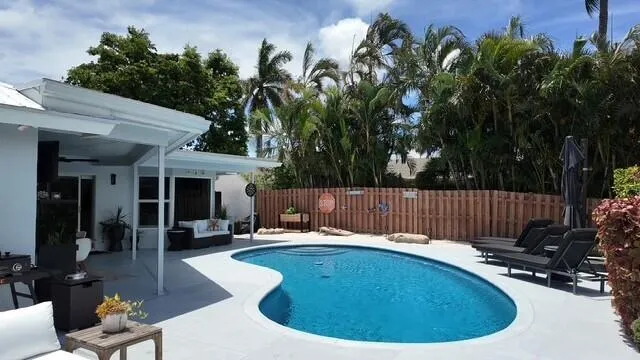 Enjoy your true Florida outdoor living with a sparkling pool, beach area, generous gathering space, and relaxing canal water views.