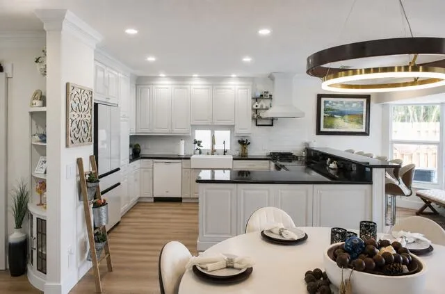 A bright remodeled kitchen, inviting space perfect for the morning coffee, family meals and entertaining.