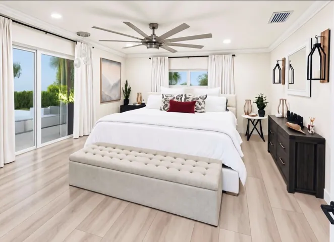 This spacious primary bedroom, with a walk in California closet offers a bright, serene retreat with Neutral finishes, warm wood flooring