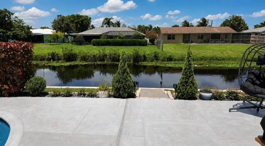 Thoughtful landscaping adds charm and character, enhancing this inviting waterfront retreat.