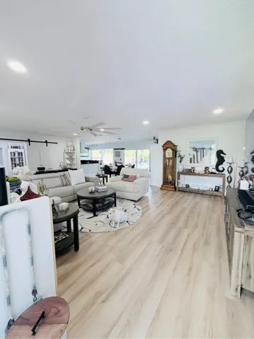 Bright, open, and beautifully designed, spacious living room area is perfect for relaxing and entertaining.