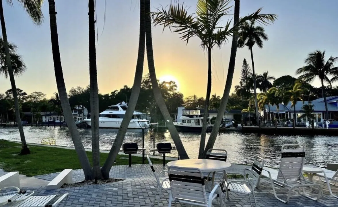 Waterfront dining area with BBQ grills, and beautiful views of passing boats