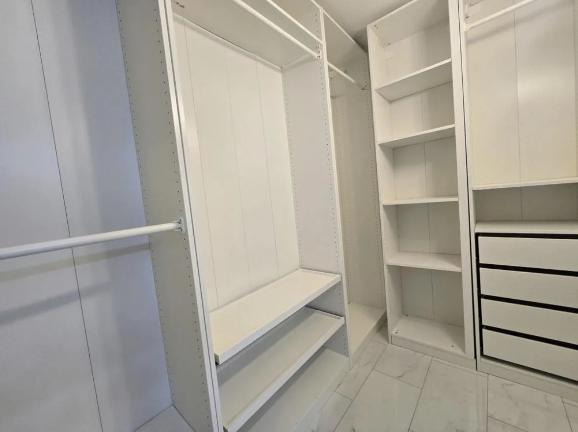 Built-Out Walk-in Closet in master suite