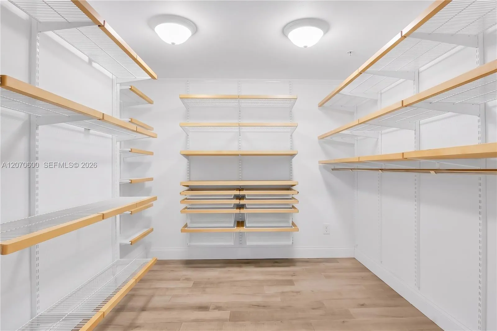 Primary bedroom walk in closet