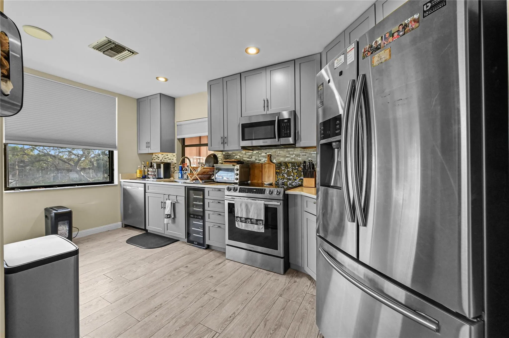 Upgraded eat in kitchen with breakfast area overlooking golf and lake view