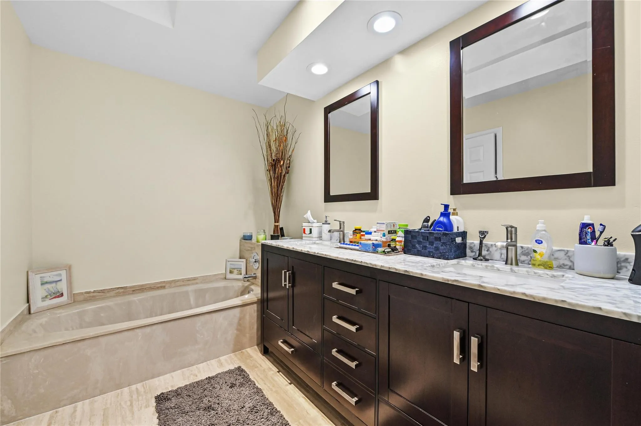 Primary bath has roman style tub and separate shower