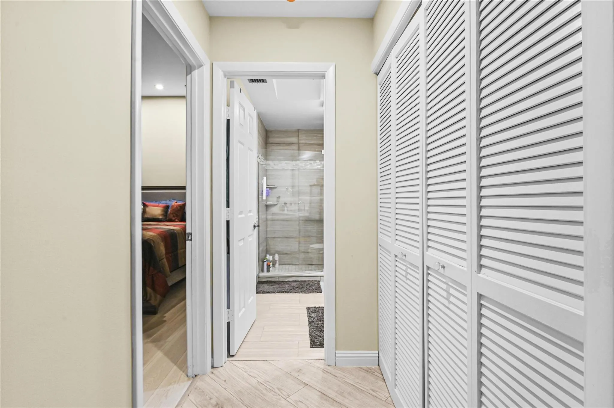 Hallway closet at entry to guest bedroom and bath