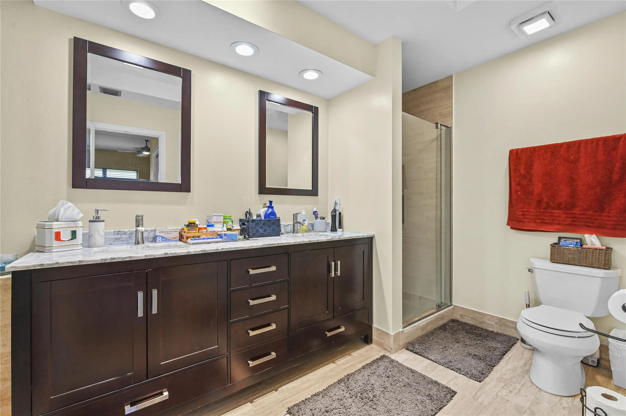 Upgraded primary bath with dual sinks and separate walk in shower