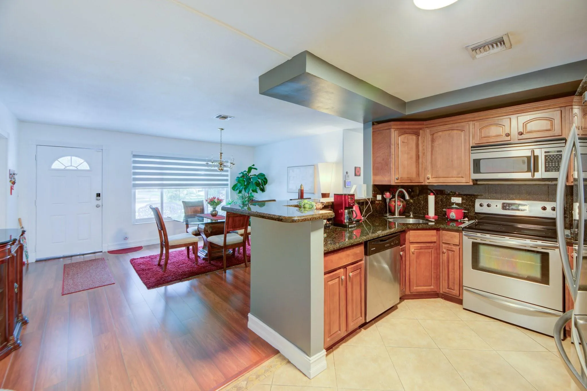 Wood cabinet & stainless steel appliances