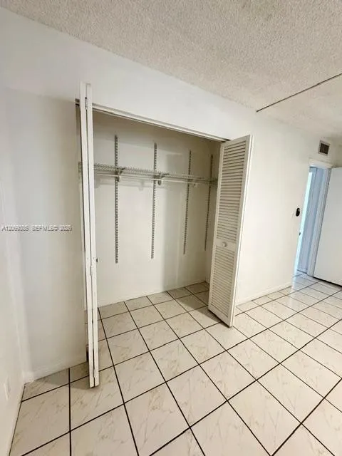 2nd bedroom closet with adjustable shelving