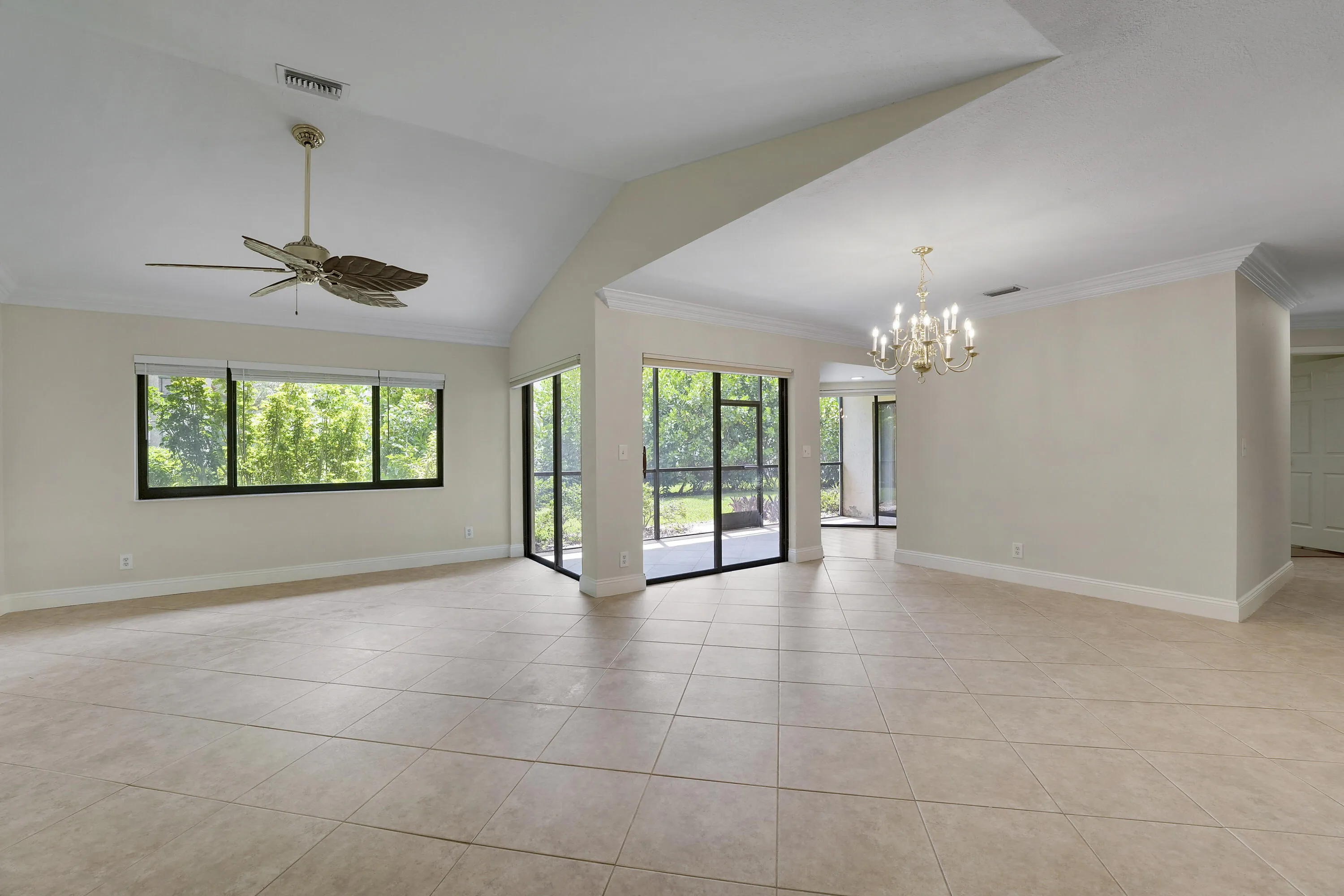 Open living and dining area with vaulted ceilings/Crown Molding