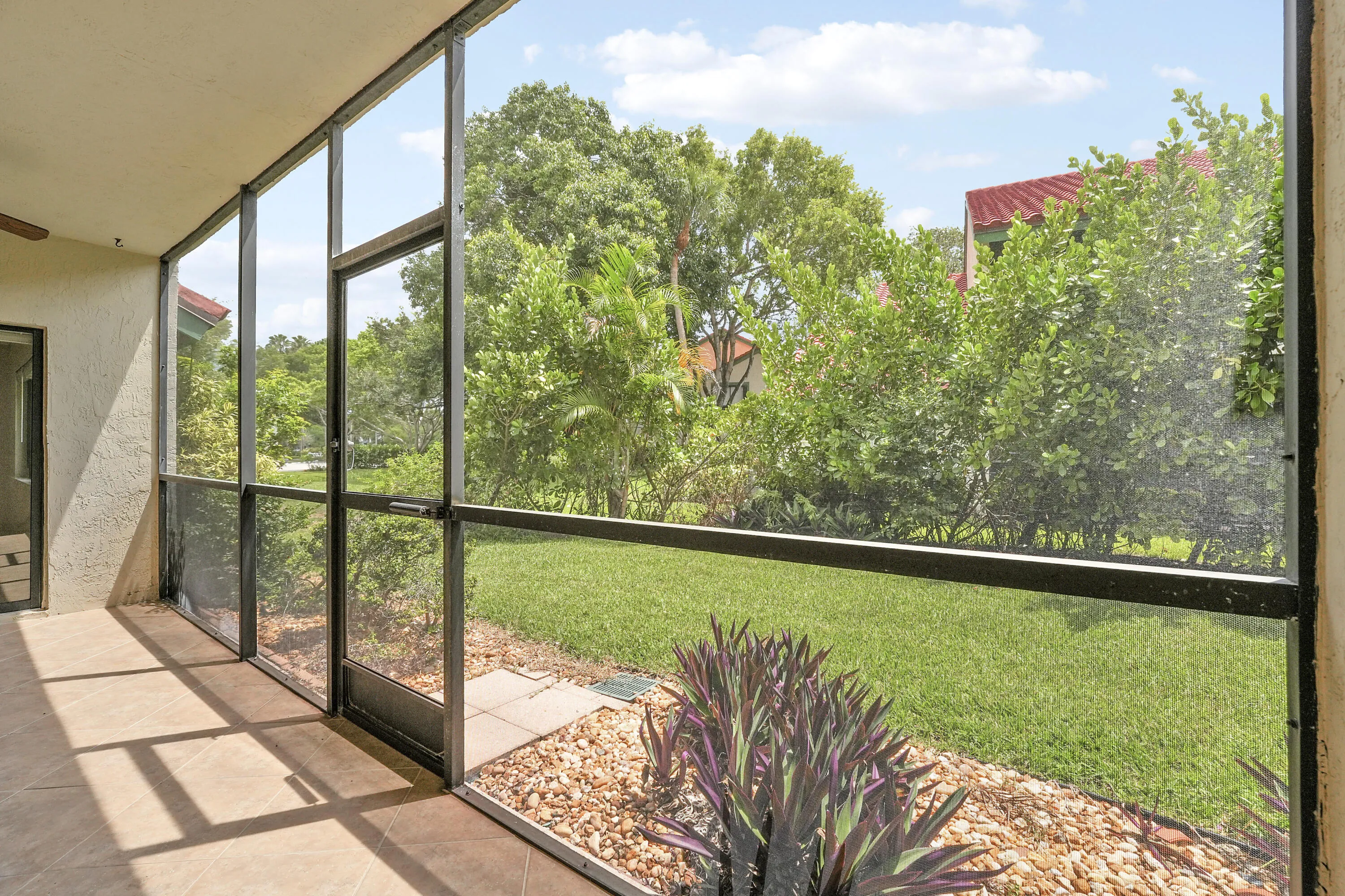 Screened in Patio with Garden Views & Partial Water Views