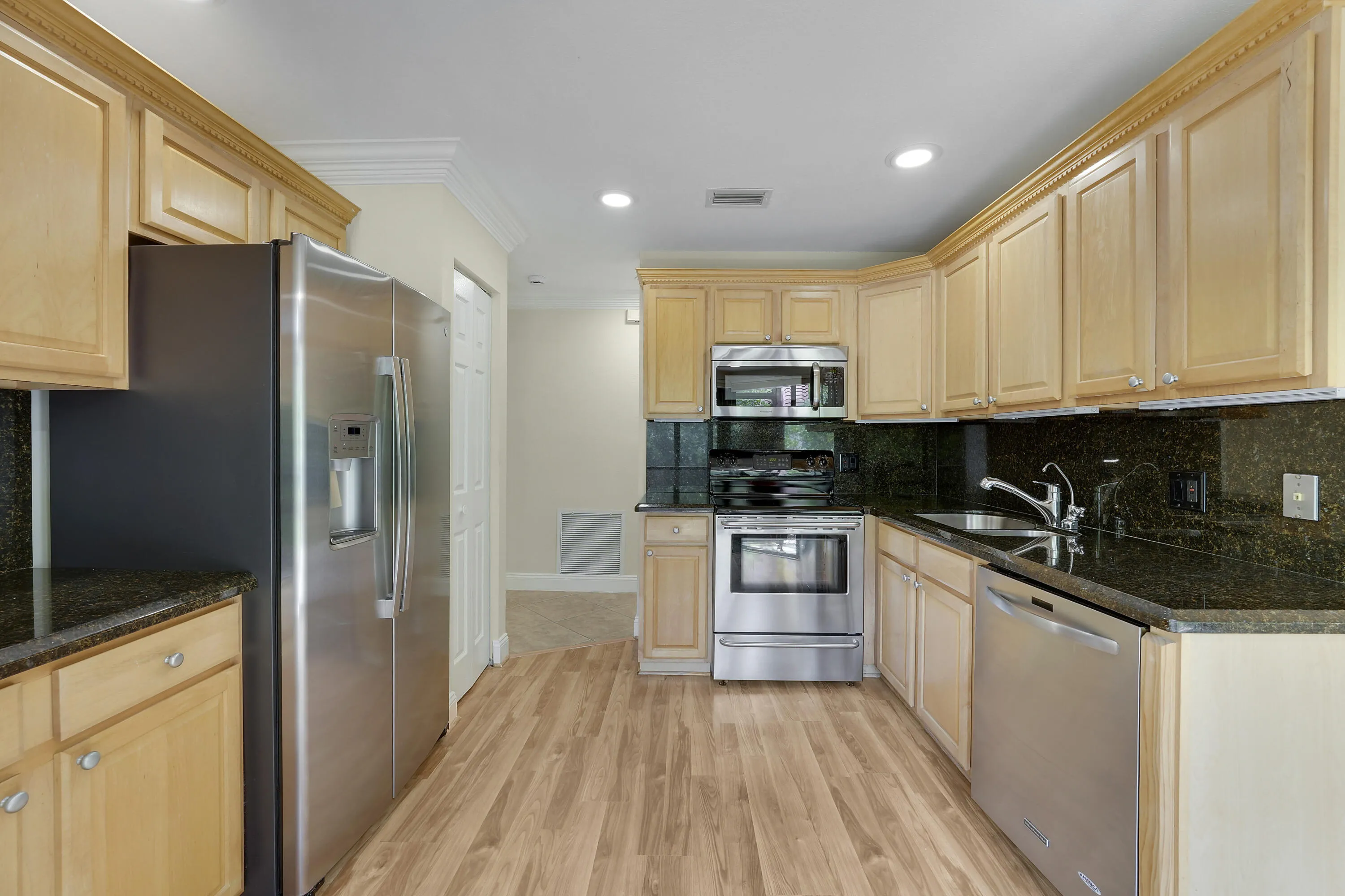 Kitchen with granite countertops and stainless steel appliances