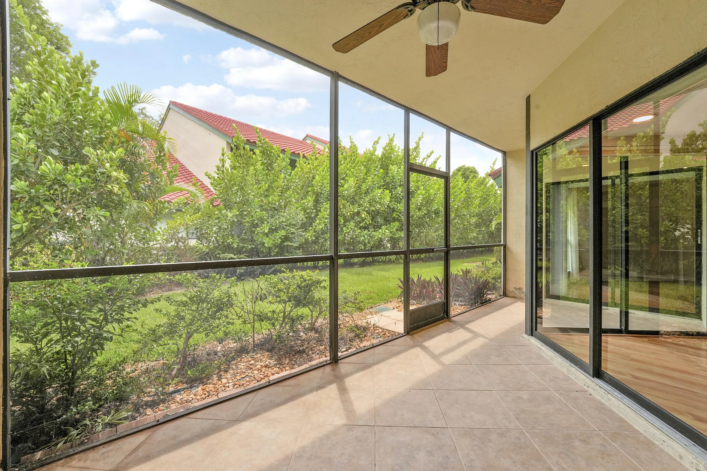 Screened patio with garden views