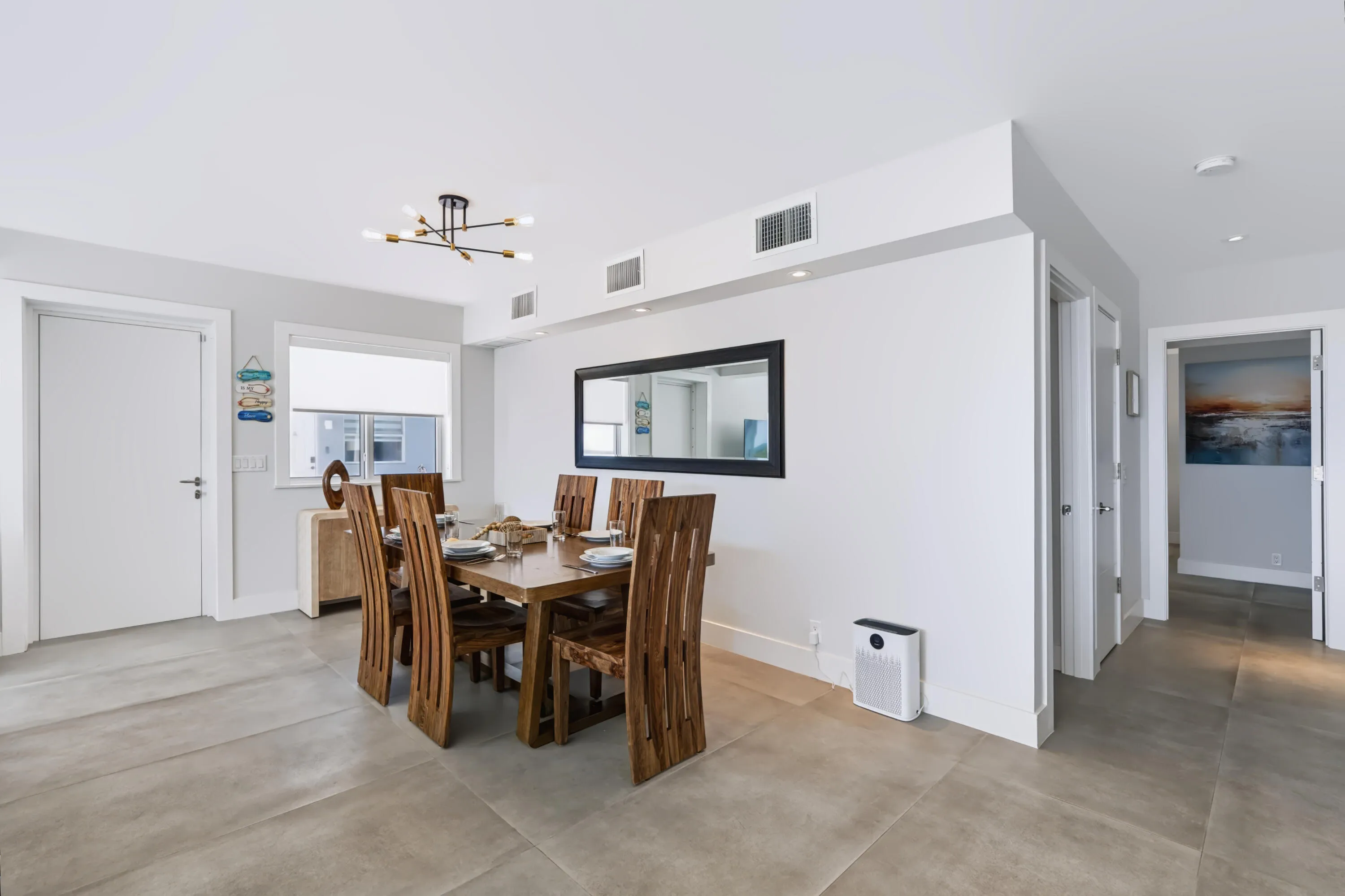 Recessed lighting, contemporary chandelier, large window, tile flooring, and white interior doors