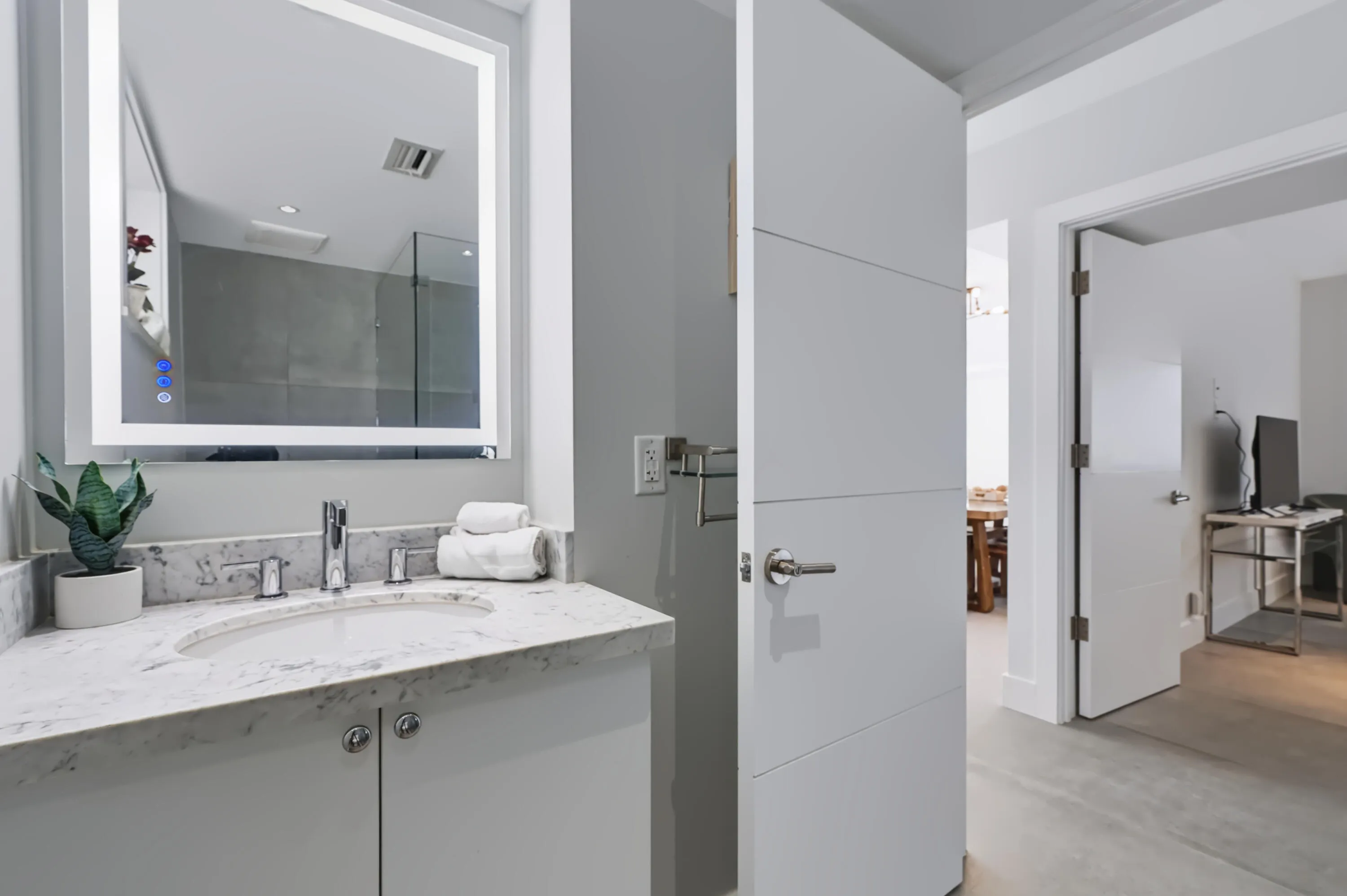 Vanity featuring a built-in vessel sink, chrome faucet, and stone countertop