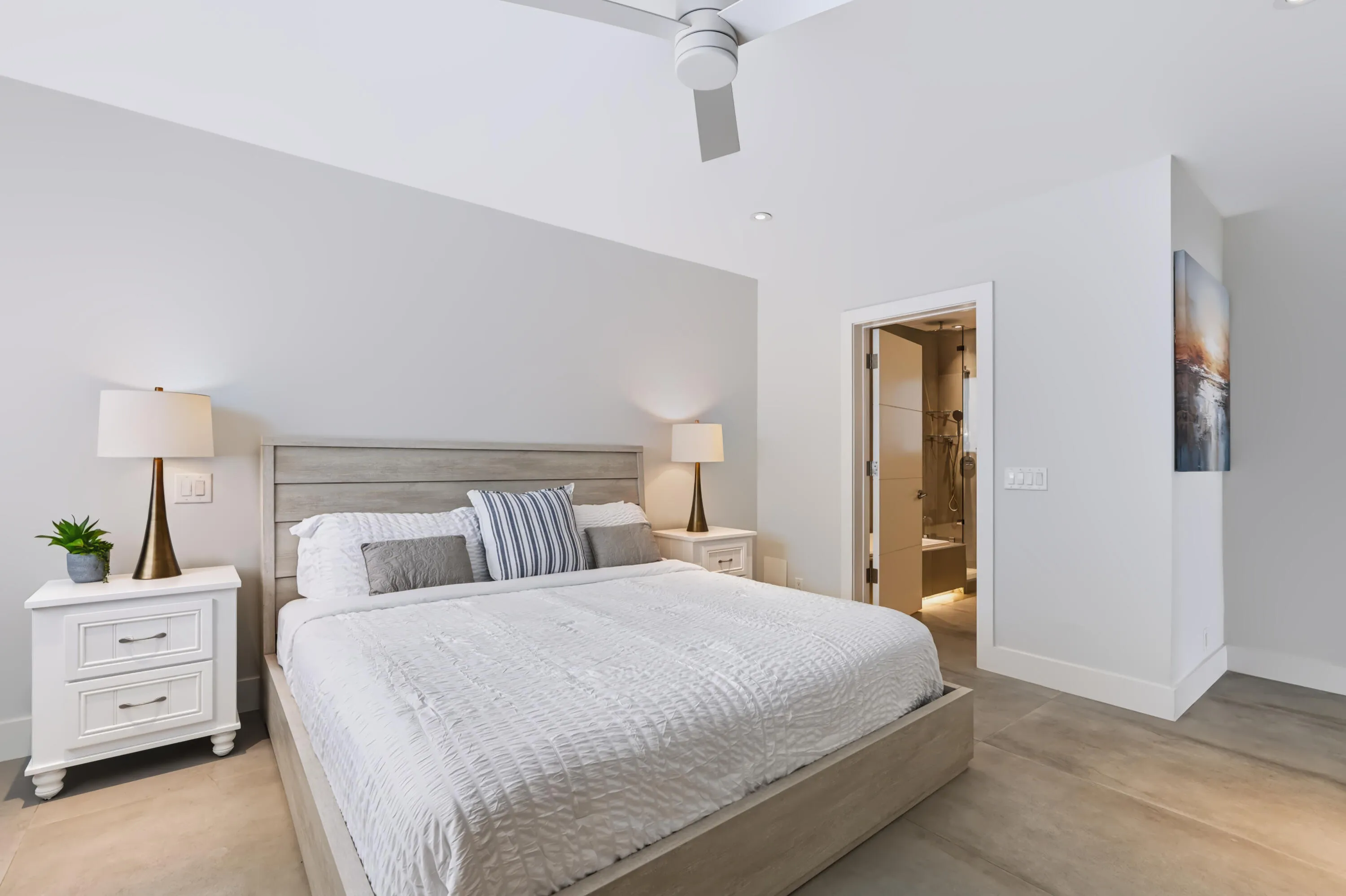Recessed lighting, wood-finish flooring, and a ceiling fan