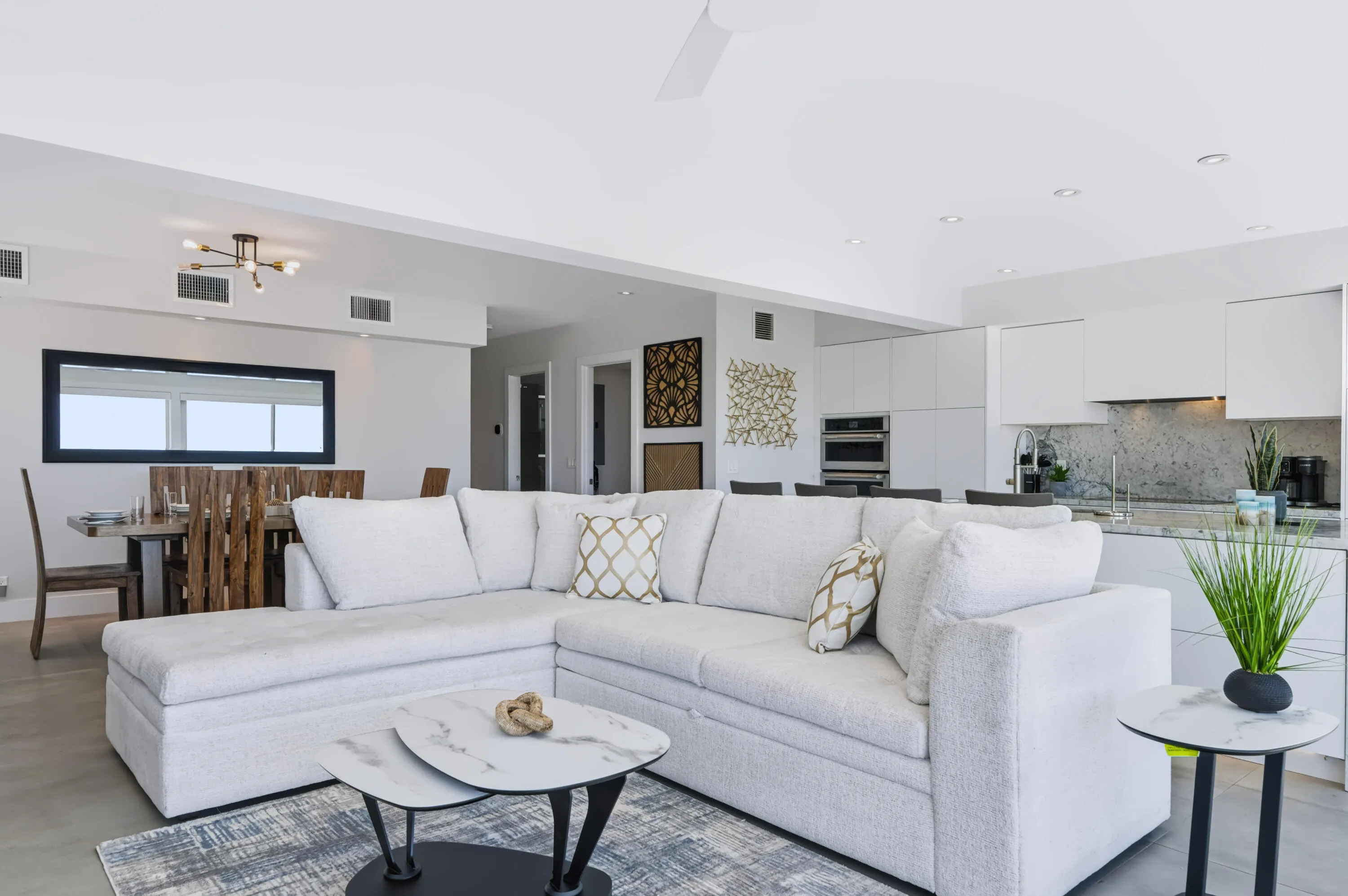 Open-concept living space with light-toned flooring