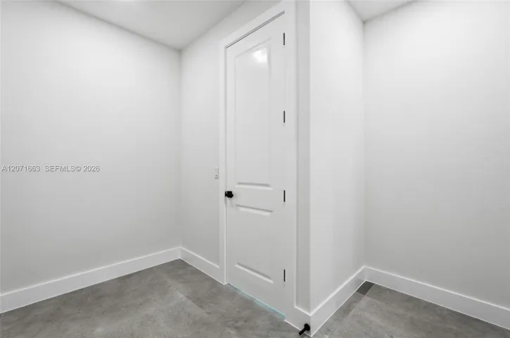 Walk in closet with access to laundry