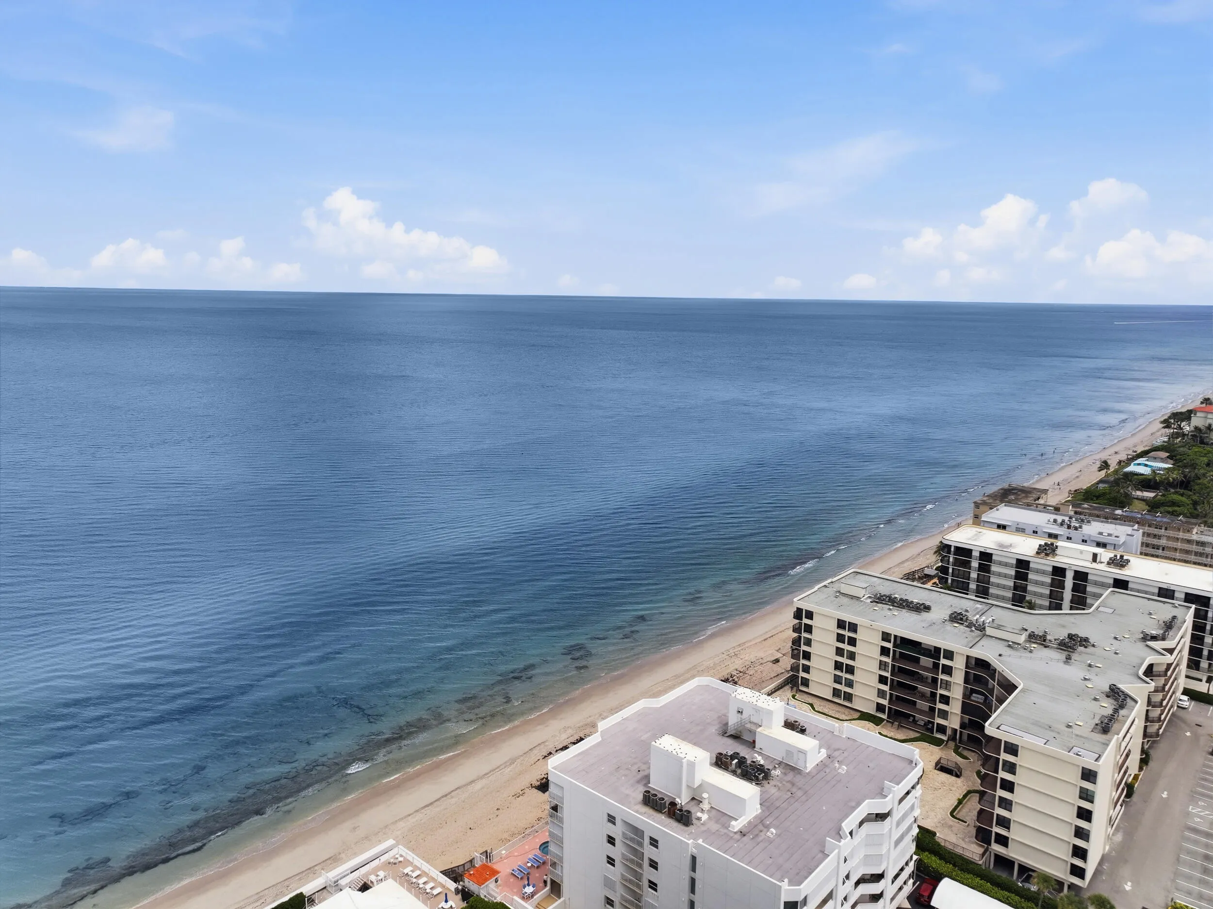 Oceanfront views featuring sandy beaches and coastal buildings
