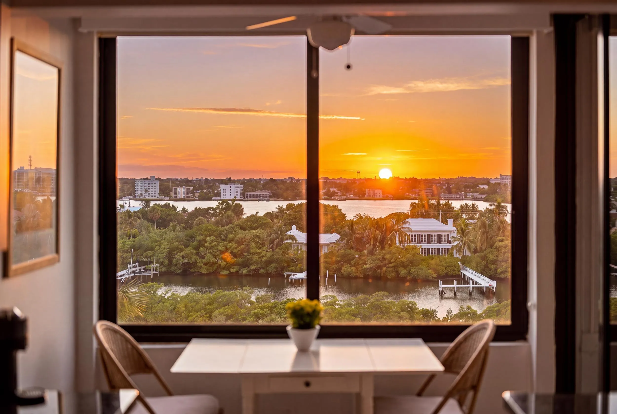 Expansive window framing waterfront scenery