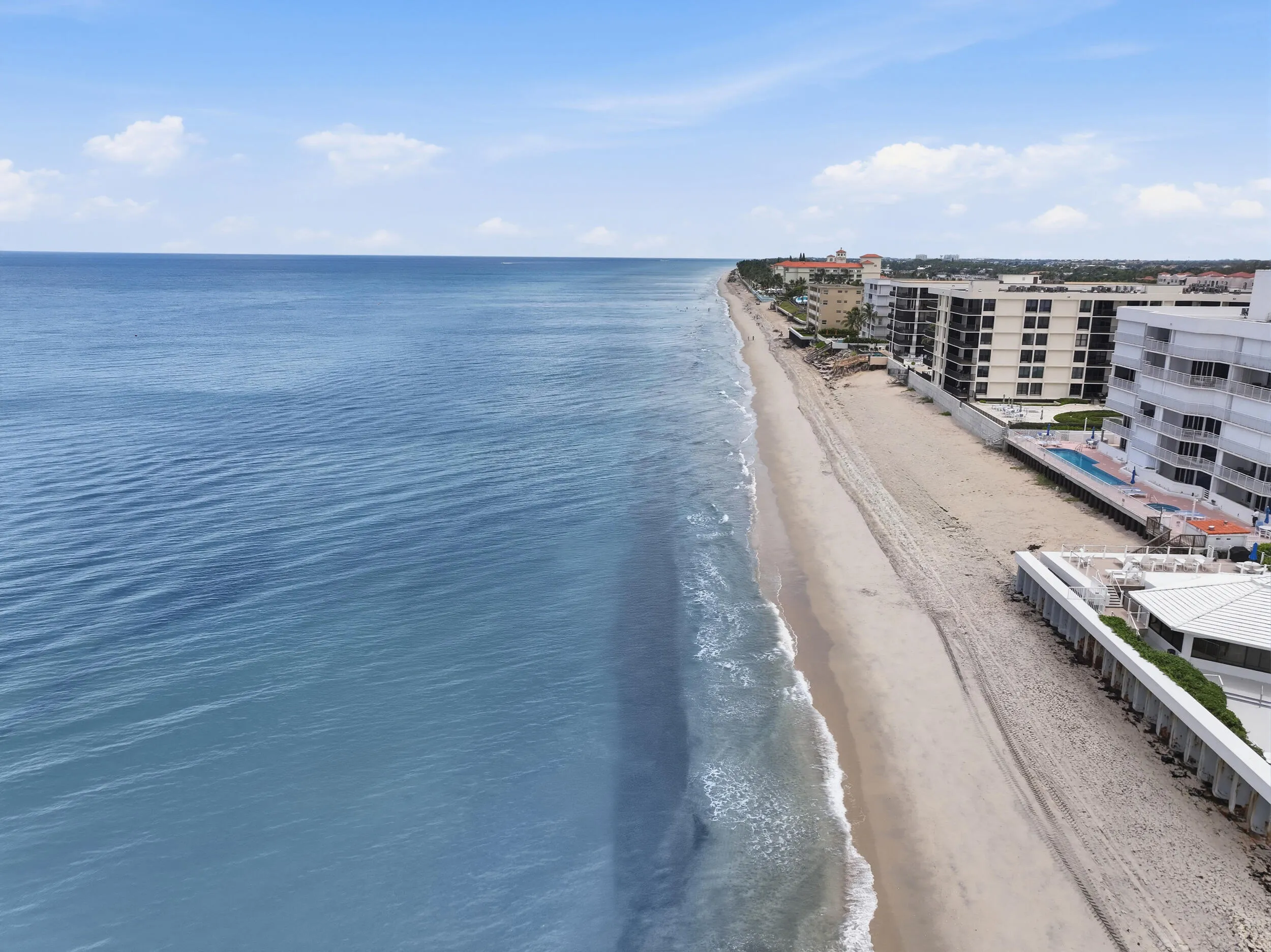 Expansive beachfront property featuring direct access to the sandy shoreline and ocean