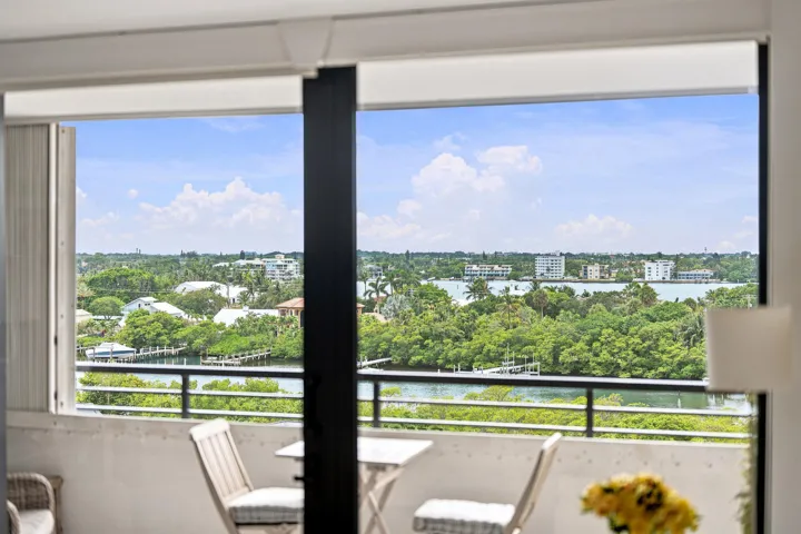 Balcony featuring a black metal railing and expansive water views