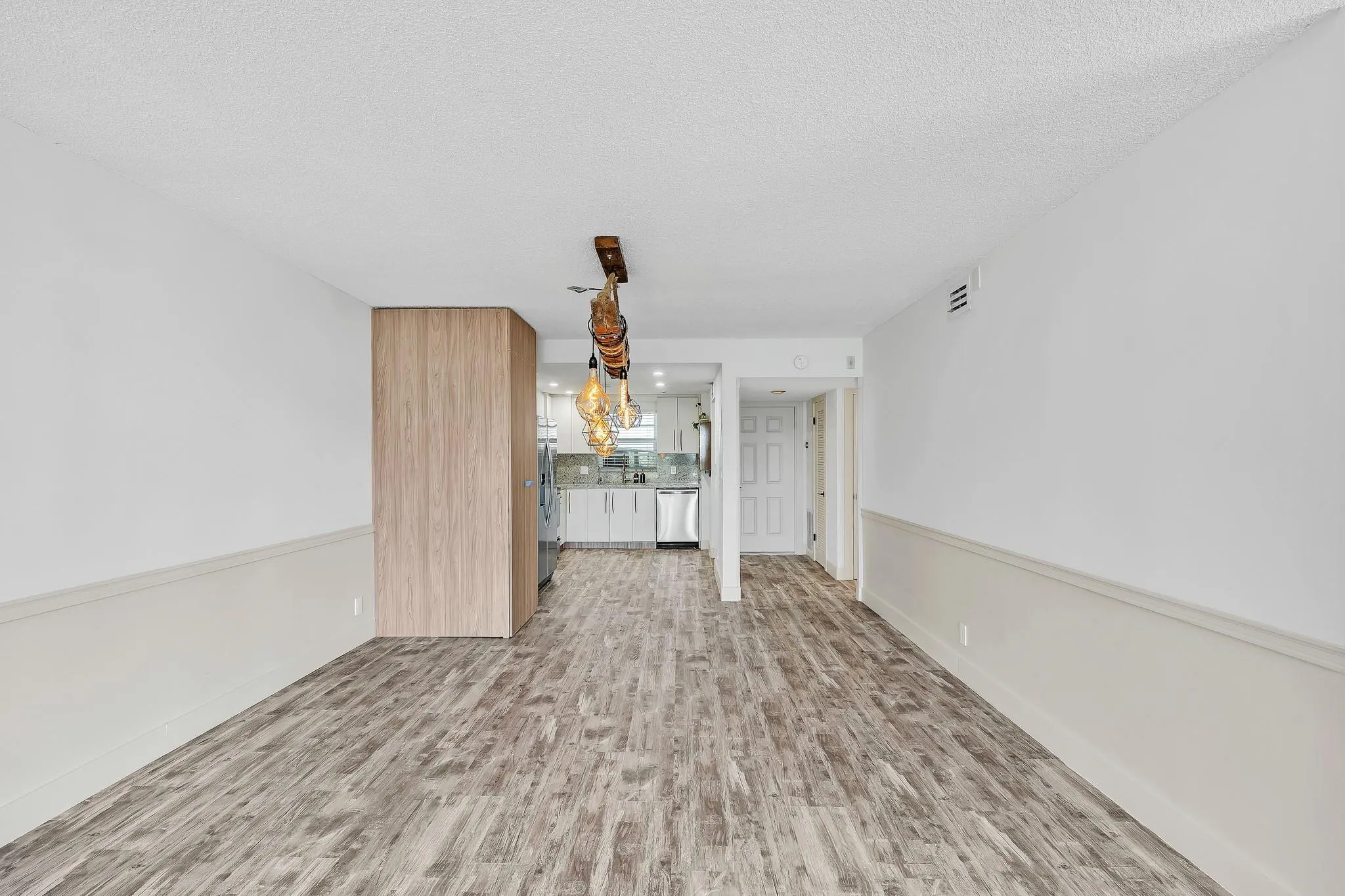 Wood-finish flooring throughout, complemented by a chair rail