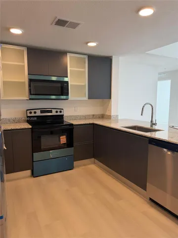 Fully equipped open kitchen offering functionality and modern comfort.