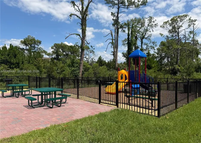 Playground with seating area for residents’ comfort and convenience.
