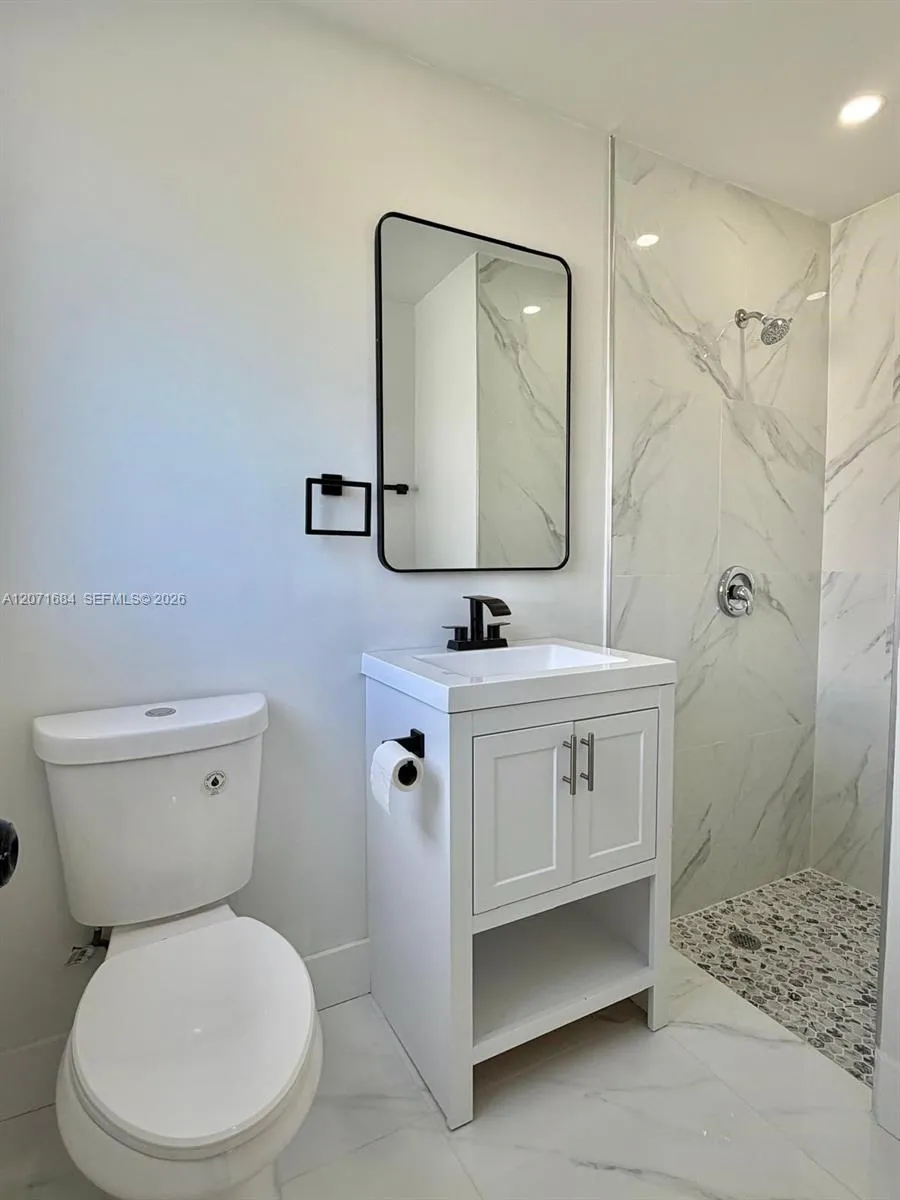 Beautifully renovated master bathroom with contemporary finishes throughout