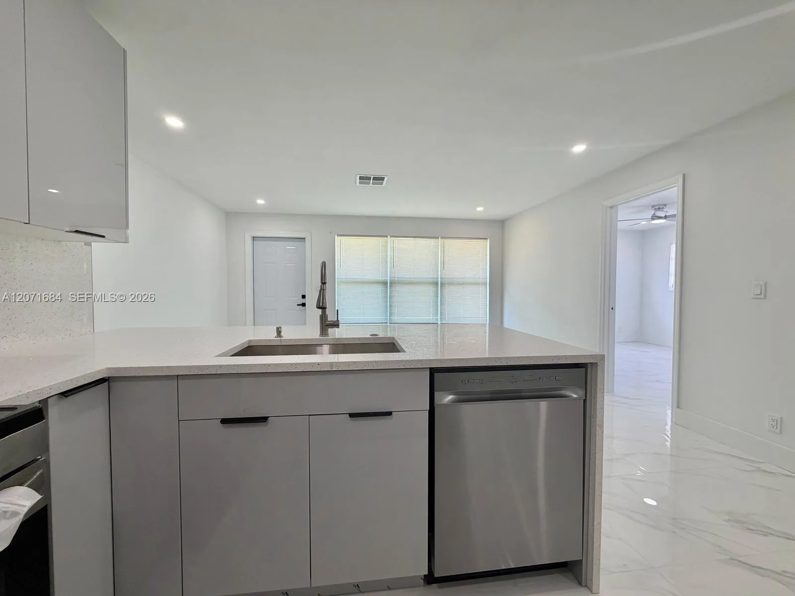 Renovated kitchen with modern cabinetry and countertops