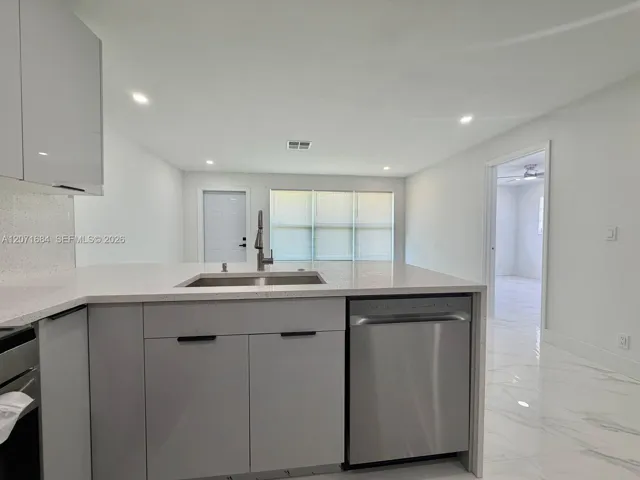 Renovated kitchen with modern cabinetry and countertops