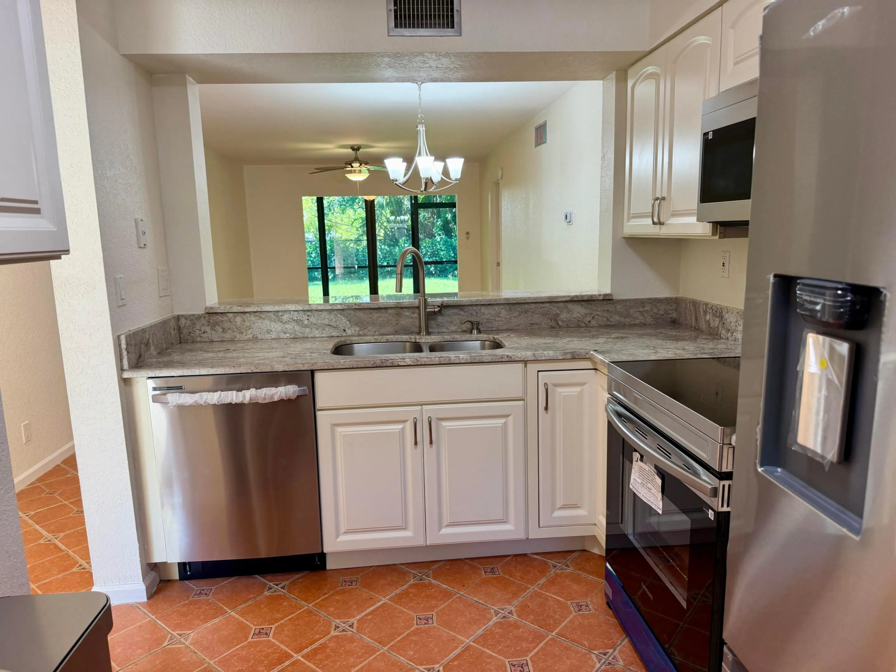 New SS Dishwasher, Range, Microwave & Refrig
