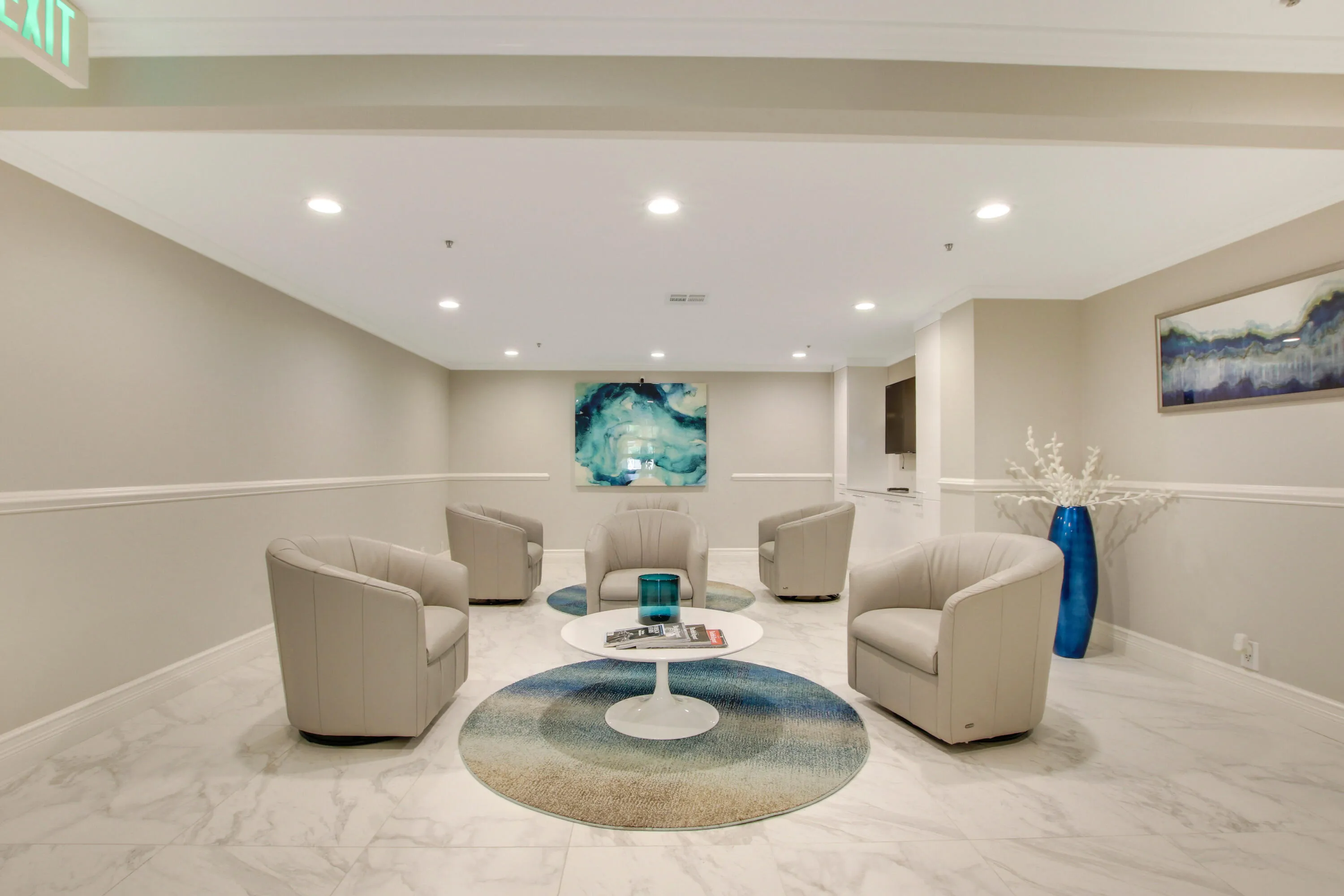 Recessed lighting, crown molding, chair rail molding, and marble-finish flooring