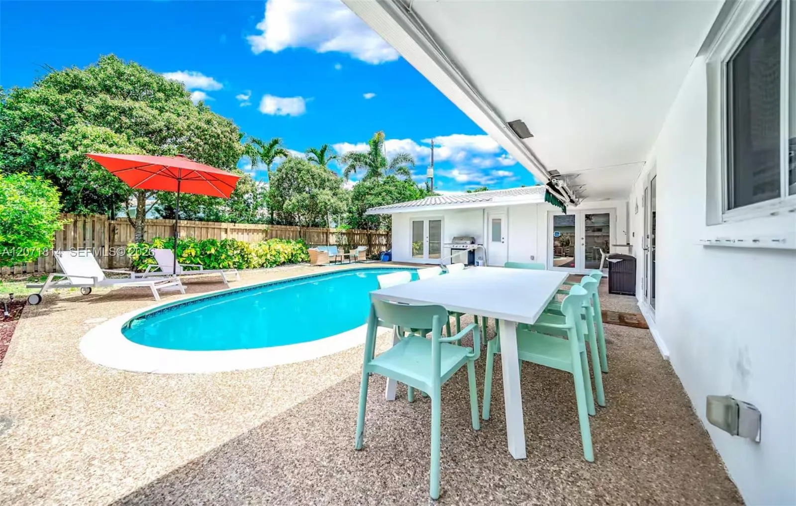 Covered patio overlooking the pool